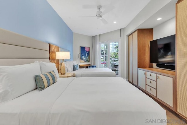 bedroom featuring ceiling fan, access to outside, and hardwood / wood-style floors