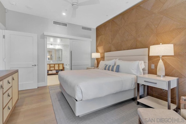 bedroom featuring light hardwood / wood-style floors and ceiling fan