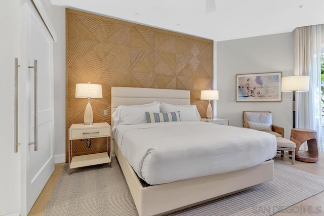 bedroom featuring ceiling fan and hardwood / wood-style flooring