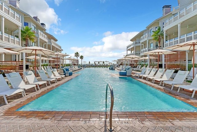 view of swimming pool with a water view