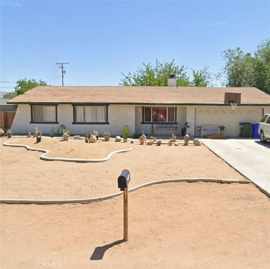 ranch-style house featuring a garage