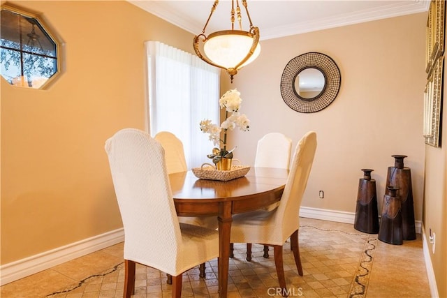 dining space with ornamental molding and light tile patterned flooring