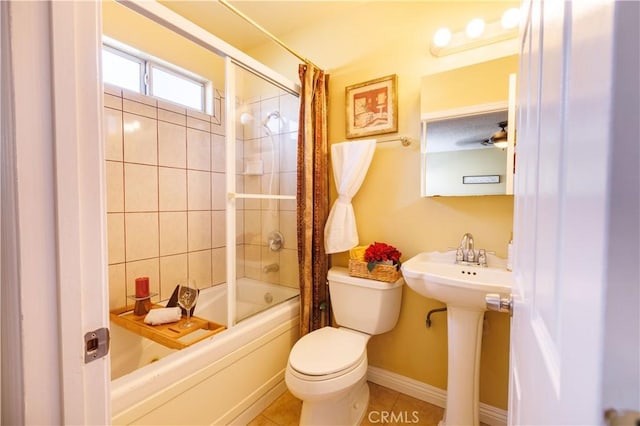 full bathroom featuring sink, tile patterned flooring, shower / bath combination with curtain, and toilet