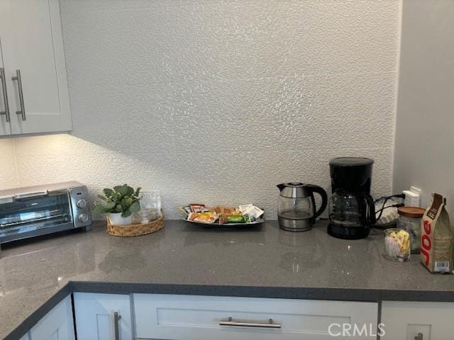 kitchen with white cabinets