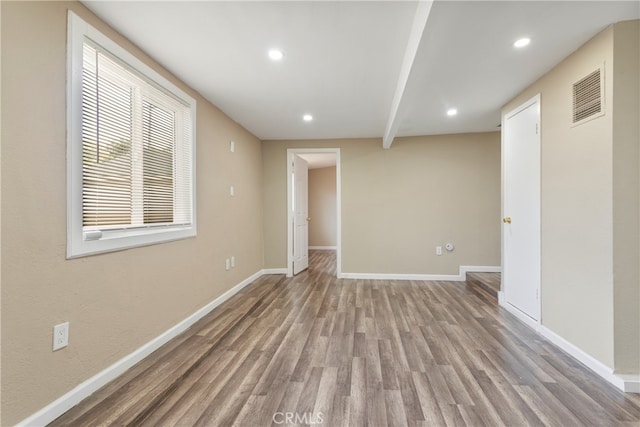 spare room with light hardwood / wood-style floors