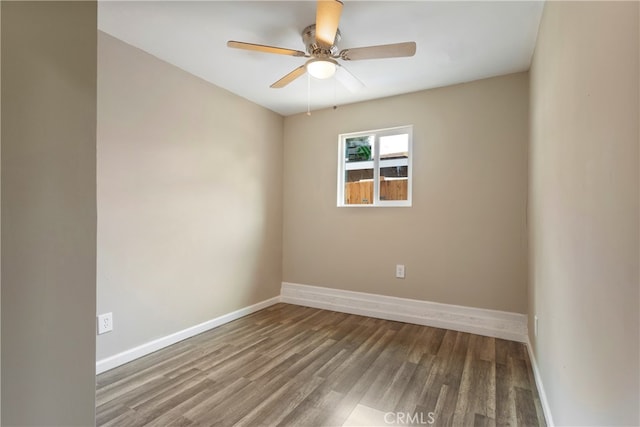 spare room featuring hardwood / wood-style flooring and ceiling fan