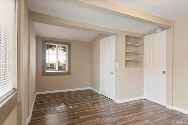 unfurnished bedroom featuring dark hardwood / wood-style floors