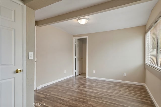 spare room with hardwood / wood-style floors