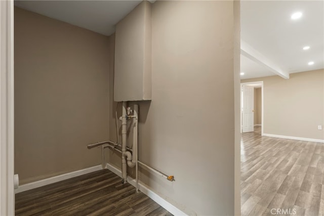 stairs featuring hardwood / wood-style floors