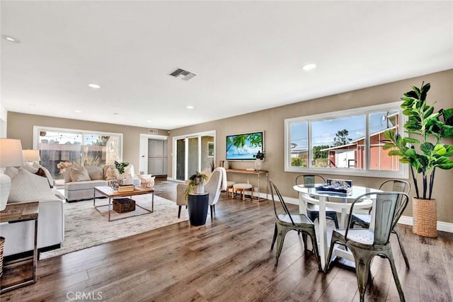 interior space with french doors, hardwood / wood-style flooring, and a wealth of natural light