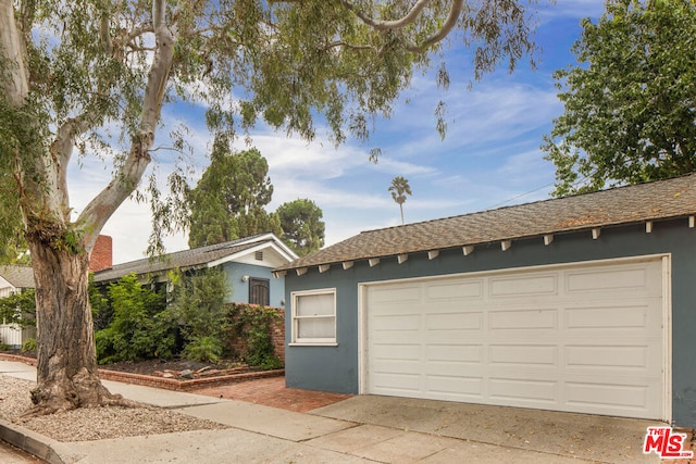 single story home featuring a garage