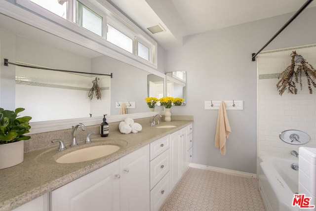 bathroom featuring vanity and tiled shower / bath combo