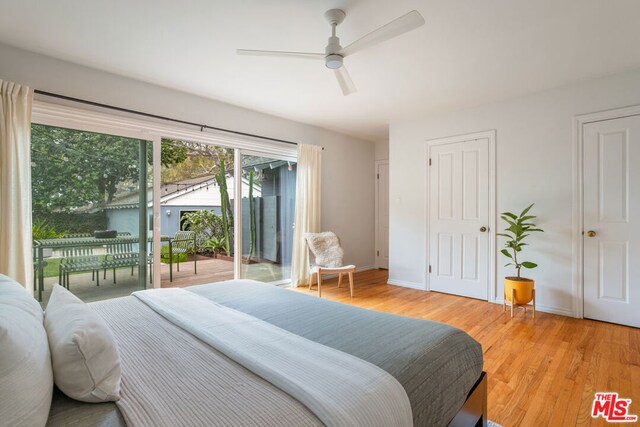 bedroom with access to outside, ceiling fan, and light hardwood / wood-style floors