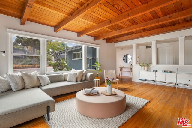 living room featuring beam ceiling, wood ceiling, and light hardwood / wood-style flooring