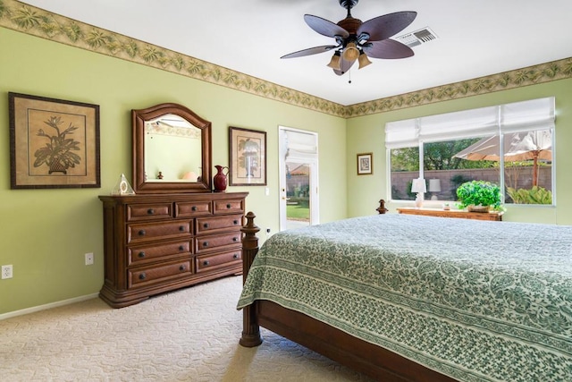 bedroom with ceiling fan and light carpet