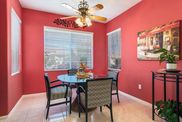 tiled dining area featuring ceiling fan