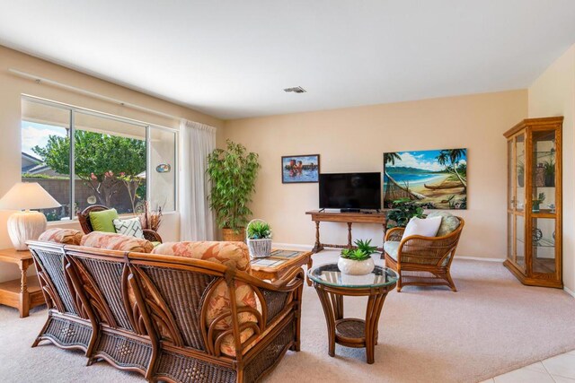 living room featuring light colored carpet and french doors