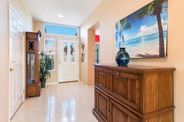 doorway to outside featuring light tile patterned floors