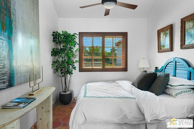 bedroom with tile patterned floors and ceiling fan