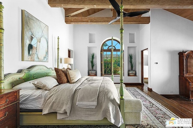 bedroom featuring dark hardwood / wood-style floors, beam ceiling, and high vaulted ceiling