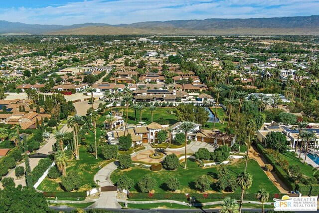 birds eye view of property with a mountain view