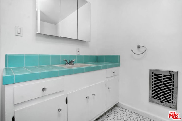 bathroom featuring tile patterned floors and vanity