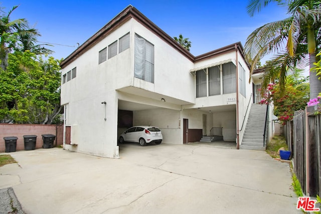 view of front of property with a carport