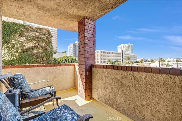 view of patio with a balcony