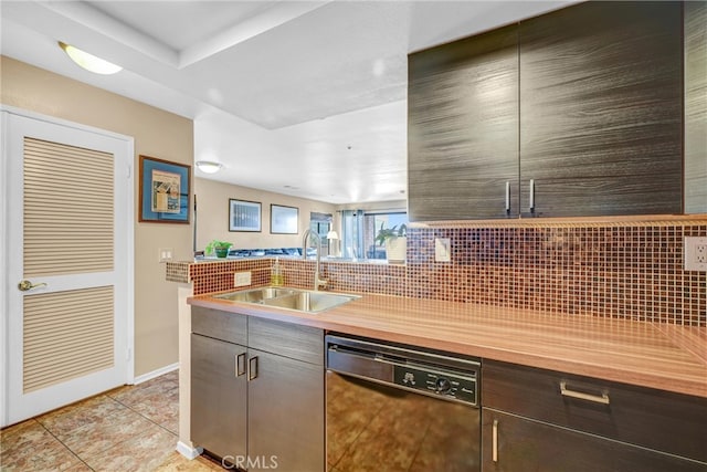 kitchen featuring sink, dishwasher, dark brown cabinets, decorative backsplash, and light tile patterned floors