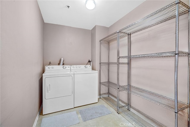 laundry room featuring washing machine and clothes dryer