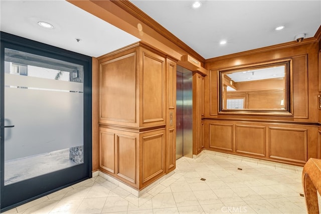 interior space featuring crown molding and elevator