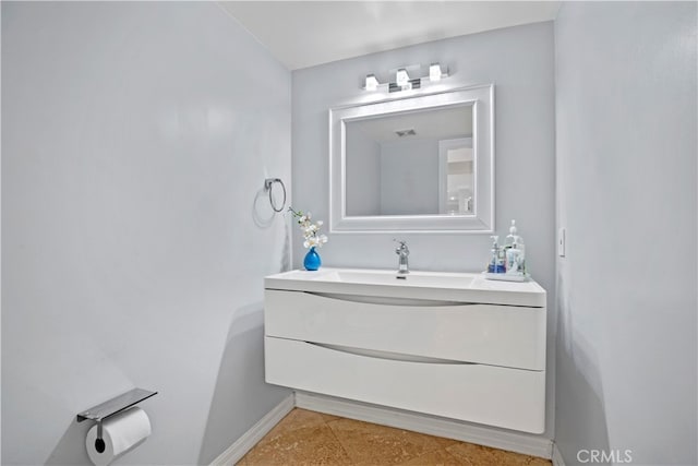 bathroom with vanity and tile patterned flooring