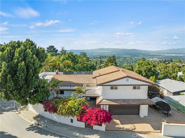 drone / aerial view featuring a mountain view