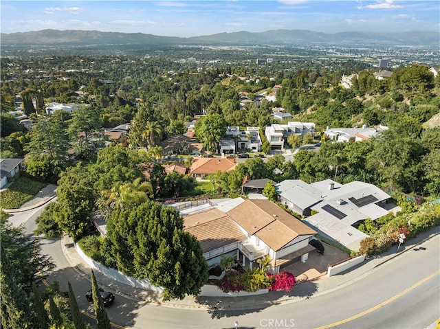 birds eye view of property with a mountain view