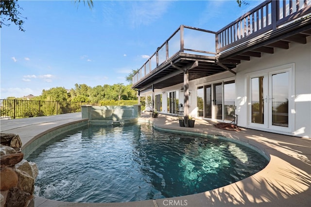 view of pool featuring french doors and a patio