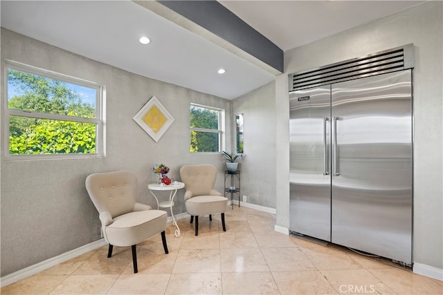 living area featuring light tile patterned floors