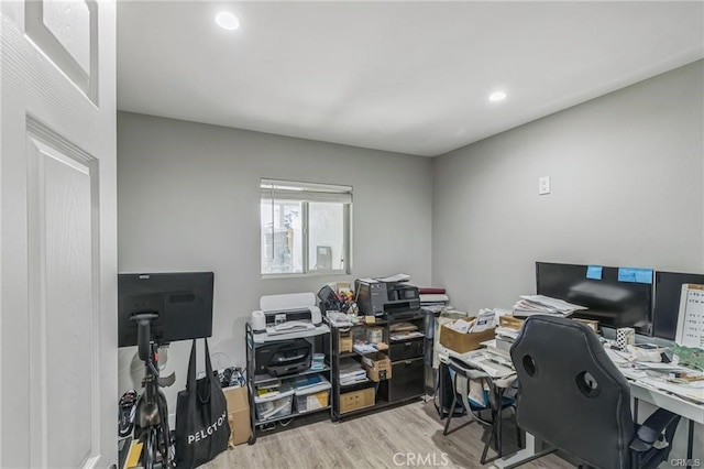 office with light hardwood / wood-style floors