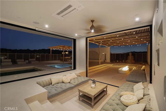 patio at twilight featuring an outdoor living space, ceiling fan, and a pool