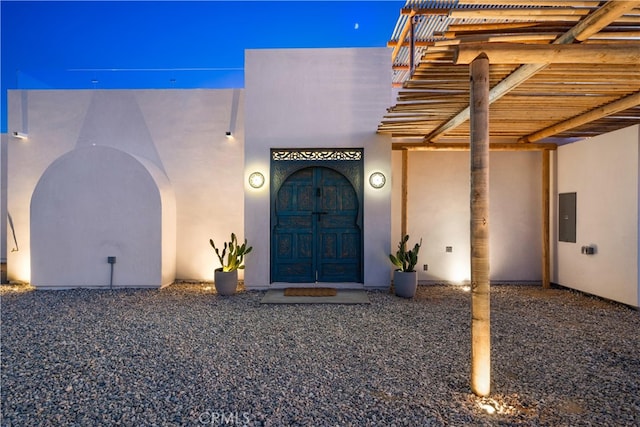 doorway to property featuring electric panel