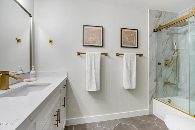 full bathroom featuring tile patterned floors, shower / bath combination with glass door, vanity, and toilet