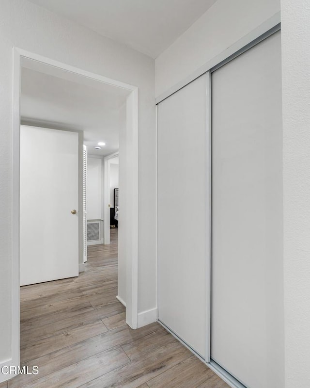 hallway featuring light wood-type flooring