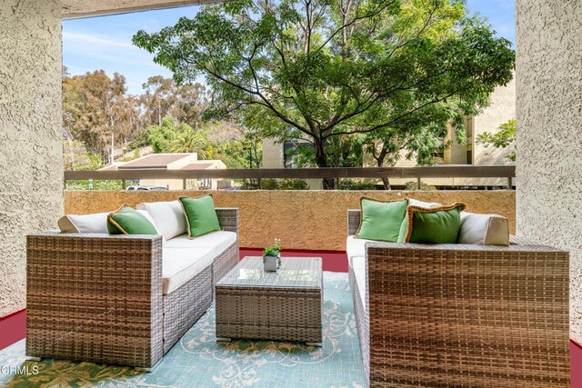 view of patio / terrace featuring an outdoor living space and a balcony