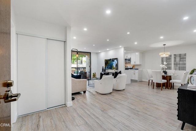 living room with light hardwood / wood-style floors