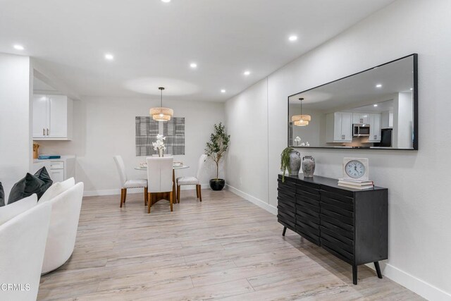 dining space featuring light hardwood / wood-style flooring