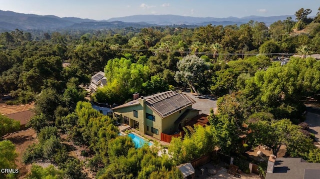 birds eye view of property featuring a mountain view