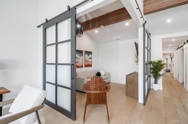 51 Catspaw, Coronado, CA 92118 - interior space with lofted ceiling with beams, a barn door, recessed lighting, and light wood finished floors