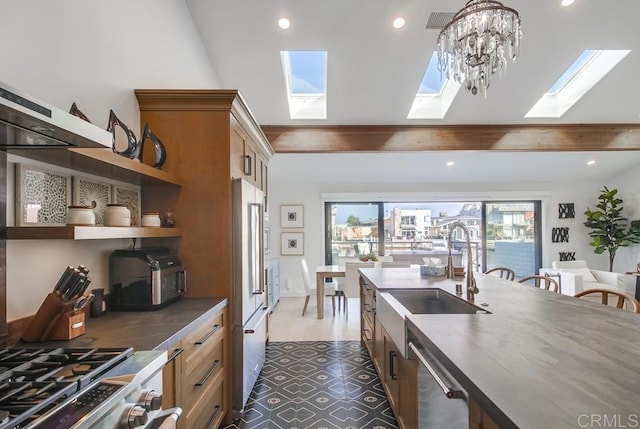 51 Catspaw, Coronado, CA 92118 - kitchen featuring a sink, open shelves, a skylight, appliances with stainless steel finishes, and recessed lighting