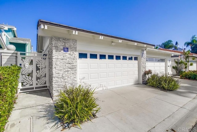 51 Catspaw, Coronado, CA 92118 - garage featuring a gate and concrete driveway