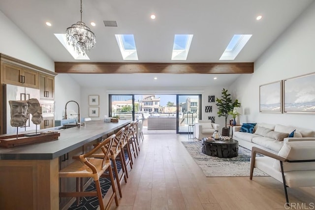 51 Catspaw, Coronado, CA 92118 - living room with light wood finished floors, visible vents, a skylight, and beam ceiling