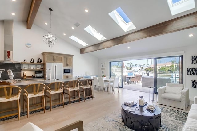 51 Catspaw, Coronado, CA 92118 - living area featuring high vaulted ceiling, beamed ceiling, a skylight, light wood finished floors, and recessed lighting